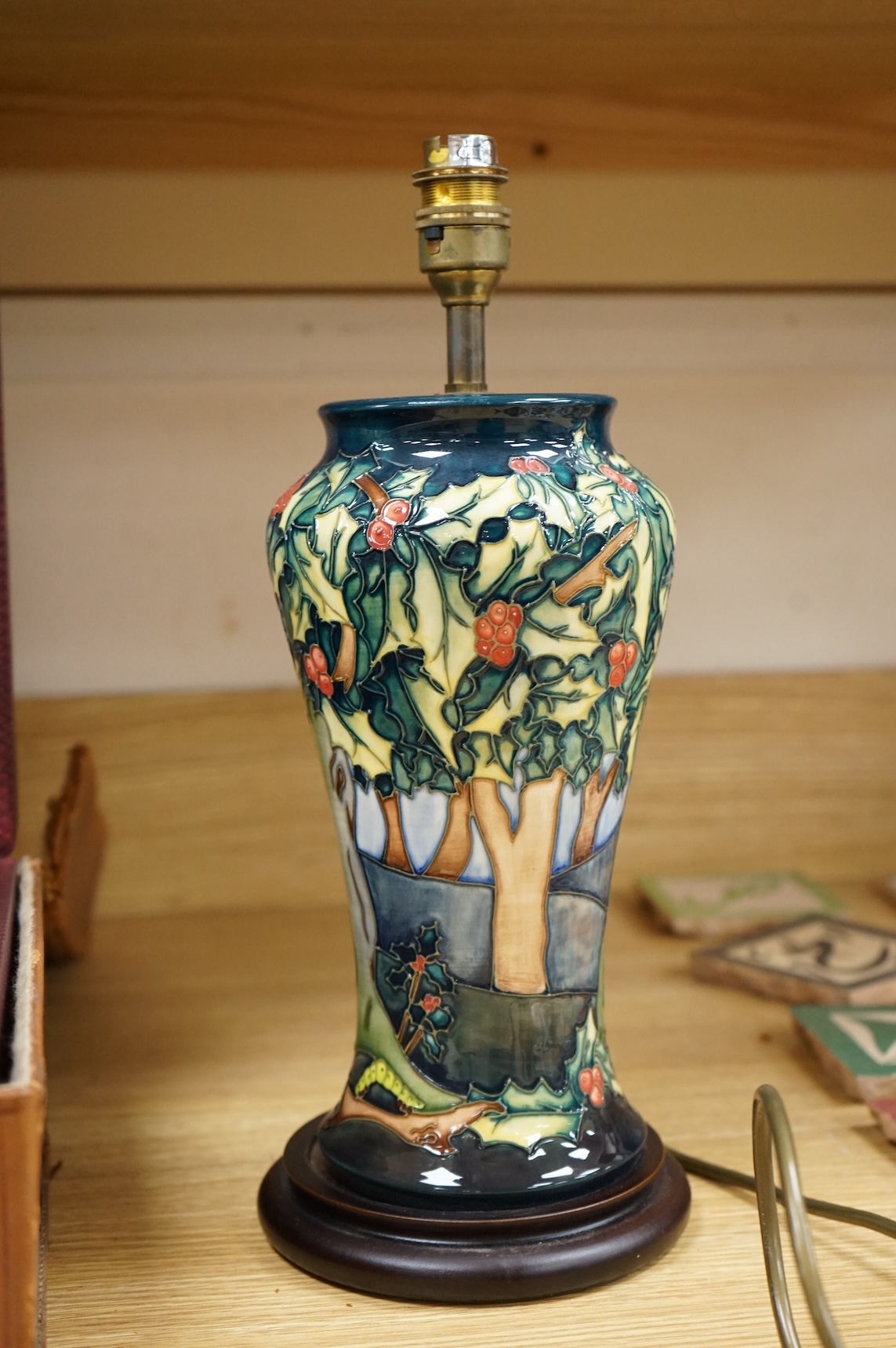 A Moorcroft lamp base decorated in the Holly Hatch pattern, 37cm high including the fitting